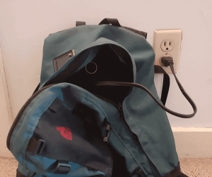 charging electric bike battery in backpack